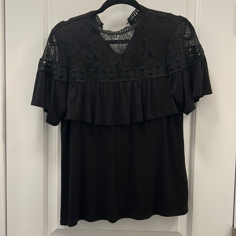 Beautiful lace neck and shoulder top.